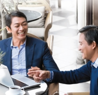 2 businessmen discussing hsbc business insights and business growth strategies while on their laptops. 2 businessmen discussing hsbc business insights and business growth strategies while on their laptops.